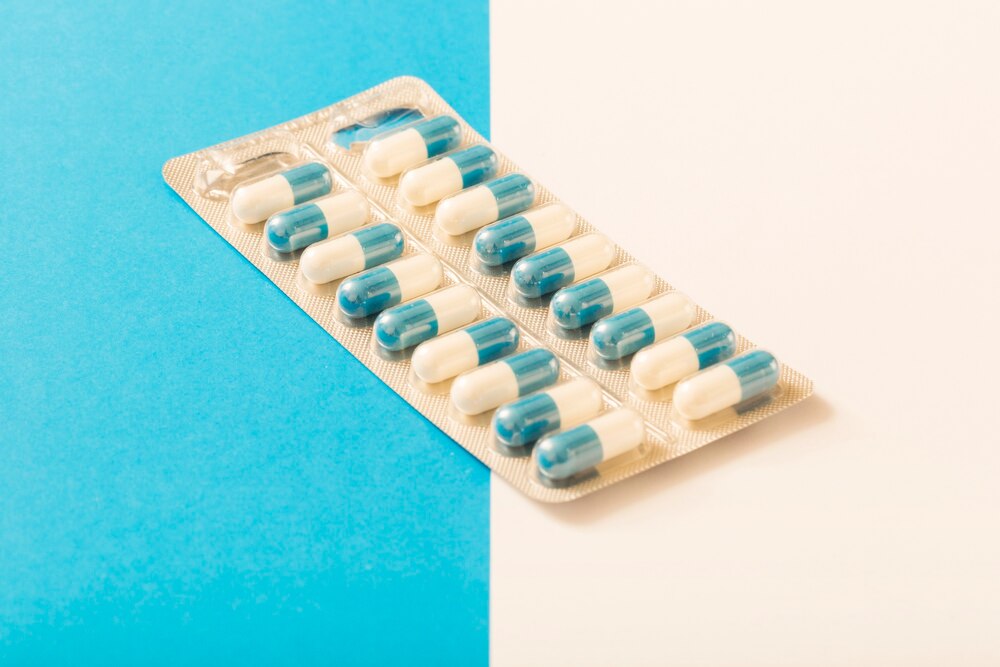 Capsules blister pack on two white and blue background
