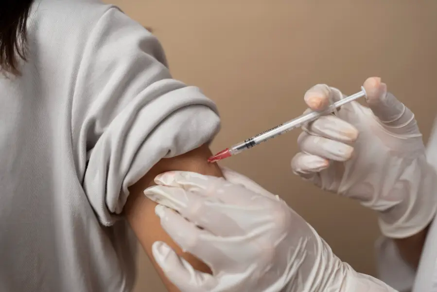 Vaccine being administered to patients arm